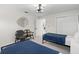 Bright bedroom showcasing twin beds, a seating area and a hallway at 1527 Buoy Ln, Osprey, FL 34229