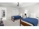 Bright bedroom features two twin beds, modern lighting fixture, and ample space at 1527 Buoy Ln, Osprey, FL 34229
