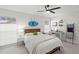 Bright bedroom features a modern design with a cozy bed, and a surf decor detail at 1527 Buoy Ln, Osprey, FL 34229