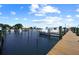 Wooden dock overlooking the marina, providing boat slip access to the water and waterfront properties at 1527 Buoy Ln, Osprey, FL 34229