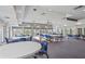 Large club room with flexible seating arrangements for events and gatherings at 1527 Buoy Ln, Osprey, FL 34229