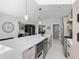 Spacious kitchen with a large island, modern appliances, and ample cabinet space at 1527 Buoy Ln, Osprey, FL 34229