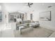 Open-concept living room and kitchen, featuring a comfortable sofa and modern decor at 1527 Buoy Ln, Osprey, FL 34229
