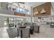 Modern lounge with high ceilings, comfortable seating, wet bar, and access to outdoor amenities at 1527 Buoy Ln, Osprey, FL 34229