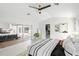 Bright main bedroom featuring neutral decor, closet access, and outdoor access at 1527 Buoy Ln, Osprey, FL 34229