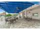 Outdoor patio area with blue ceiling, tables, chairs, and bar area; perfect for entertaining guests at 1527 Buoy Ln, Osprey, FL 34229