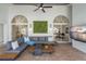 Beautiful outdoor patio with a large comfy sectional, a unique green wall decor, and a view of the outdoor pool at 1527 Buoy Ln, Osprey, FL 34229