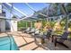 Inviting screened-in pool area featuring comfortable lounge seating and a relaxing outdoor space at 1527 Buoy Ln, Osprey, FL 34229