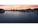 Scenic waterfront community with boats docked at sunset, offering serene residential living at 1527 Buoy Ln, Osprey, FL 34229