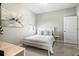 Cozy bedroom with neutral decor, a large window, and a tranquil atmosphere, perfect for relaxation at 17547 Cantarina Cv, Bradenton, FL 34211