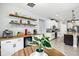 Beautiful kitchen view showcasing a coffee bar, floating shelves, stainless appliances, and modern countertops at 17547 Cantarina Cv, Bradenton, FL 34211