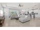 Spacious living area showcasing a large sectional, open layout, and seamless transition to the kitchen at 17547 Cantarina Cv, Bradenton, FL 34211