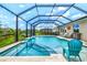 The screened pool includes a spa and spacious patio, all surrounded by lush greenery, offering a private escape at 17547 Cantarina Cv, Bradenton, FL 34211