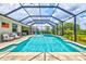 The clear blue water of this stunning screened pool highlights its many features for relaxation and recreation at 17547 Cantarina Cv, Bradenton, FL 34211