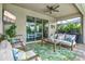 This screened-in patio provides a comfortable seating area with views from inside the house at 17547 Cantarina Cv, Bradenton, FL 34211