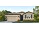 Charming single-story home featuring stone accents, a two-car garage and well-maintained landscaping at 17805 Pastureland Ave, Lakewood Ranch, FL 34211