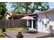 Outdoor patio area with a table, chairs, and umbrella for relaxation in the backyard at 204 36Th W St, Bradenton, FL 34205