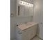 Classic bathroom vanity with ample storage, stylish lighting, and a marble countertop at 204 36Th W St, Bradenton, FL 34205