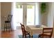 Well-lit dining space with hardwood floors and doors leading to an outdoor area at 204 36Th W St, Bradenton, FL 34205
