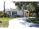 Inviting single-story home with a curved driveway and well-maintained lawn at 204 36Th W St, Bradenton, FL 34205