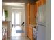 Kitchen with wood cabinets that overlooks the hardwood floors of an adjacent room at 204 36Th W St, Bradenton, FL 34205