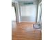 Bright room with hardwood floors and a window, enhanced by a decorative rug and elegant lighting at 204 36Th W St, Bradenton, FL 34205