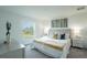 Serene bedroom featuring soft colors, plush bedding, and a tranquil view from the window at 2081 Basin St, Port Charlotte, FL 33952