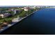 Stunning aerial view of the waterfront with palm trees and a walking path near a bay at 2105 19Th W St, Bradenton, FL 34205