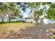 Extensive backyard showcasing a well-maintained lawn, privacy fence, and ample space for outdoor enjoyment at 2105 19Th W St, Bradenton, FL 34205