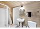 Bathroom features a walk-in shower, a pedestal sink, and neutral-toned walls at 2105 19Th W St, Bradenton, FL 34205