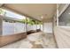 View of the covered carport area featuring a white privacy fence and extra storage at 2105 19Th W St, Bradenton, FL 34205