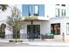 The stylish Oak & Stone building features a sleek design with ample windows and inviting outdoor seating at 2105 19Th W St, Bradenton, FL 34205