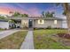 Charming single-story home featuring a covered carport and a well-maintained front yard at 2105 19Th W St, Bradenton, FL 34205