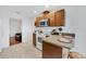 Compact kitchen features wood cabinetry, a white range, and a stainless steel microwave at 2105 19Th W St, Bradenton, FL 34205