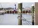 A waterfront property featuring pristine docks with stunning view and a bird sitting on the boat at 2105 19Th W St, Bradenton, FL 34205
