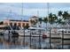 Waterfront property with boat docks, stunning architecture, and lush tropical landscaping with palm trees at 2105 19Th W St, Bradenton, FL 34205