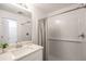 Clean bathroom featuring a shower with subway tile, a modern vanity, and a large mirror at 23327 Van Buren Ave, Punta Gorda, FL 33980
