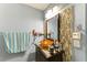 Well-lit bathroom featuring a unique vanity with a vessel sink and decorative tile accents at 2726 Desoto Rd, Sarasota, FL 34234
