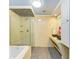 Bathroom with modern style sink bowls, light tile, and glass enclosed shower at 2726 Desoto Rd, Sarasota, FL 34234