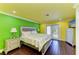 Brightly-lit bedroom with colorful walls, stylish furniture and hardwood flooring at 2726 Desoto Rd, Sarasota, FL 34234