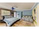 Spacious bedroom featuring mixed wall textures, ceiling fan and tile flooring at 2726 Desoto Rd, Sarasota, FL 34234