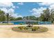 Expansive blue house with a circular drive and landscaped fountain at 2726 Desoto Rd, Sarasota, FL 34234