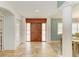 Inviting foyer with marble floors, a wood door, and adjacent dining room at 2726 Desoto Rd, Sarasota, FL 34234