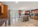 Spacious kitchen with a center island, stainless steel appliances, and tile flooring at 2726 Desoto Rd, Sarasota, FL 34234