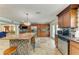 Open kitchen showcasing a granite island, stainless steel appliances, and seamless access to living spaces at 2726 Desoto Rd, Sarasota, FL 34234