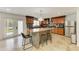 Well-lit kitchen features tile floors, granite counters, stainless appliances and an island with seating at 2726 Desoto Rd, Sarasota, FL 34234