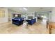 Open floor plan showing living area with tile flooring, fireplace and adjoined kitchen at 2726 Desoto Rd, Sarasota, FL 34234