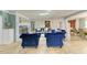 Comfortable living area with tiled floor, fireplace, and plush blue seating at 2726 Desoto Rd, Sarasota, FL 34234