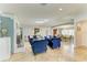 Spacious living room with tile floors, a fireplace, and comfortable blue furniture at 2726 Desoto Rd, Sarasota, FL 34234