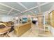 Bright living room with tile floors, coffered ceilings, and views into the dining area at 2726 Desoto Rd, Sarasota, FL 34234